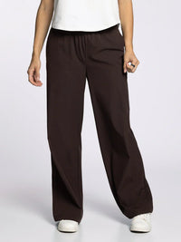Women’s dark brown supply walker pants with elastic waistband and wide-leg design