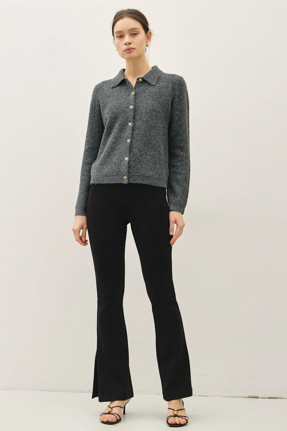 Soft wool blend women’s cardigan with black flared pants and strappy high heels