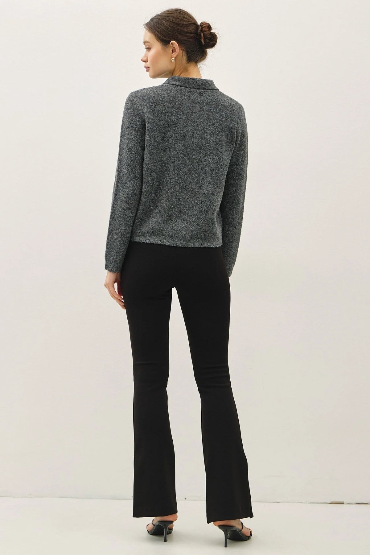 Women’s dark gray soft wool blend long-sleeved polo shirt with flare-leg pants and heels