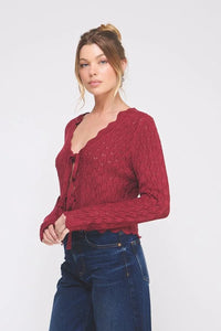 Women’s dark red knit tie cardigan with scalloped V-neck and button closure, perfect for women’s boho chic clothing