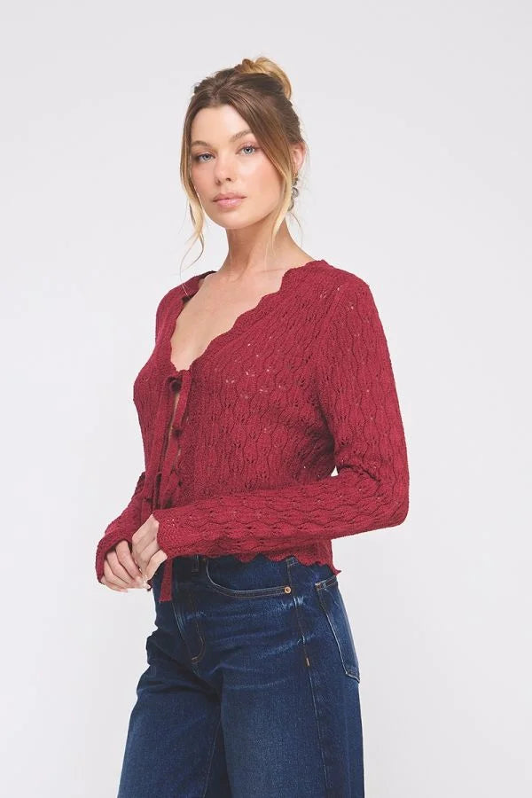Women’s dark red knit tie cardigan with scalloped V-neck and button closure, perfect for women’s boho chic clothing