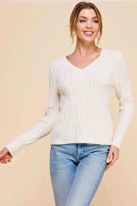 Women’s off-white soft cloud ribbed v-neck pullover sweater displayed in product image