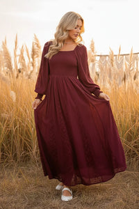 Women’s long-sleeved burgundy lace inset smocked maxi dress with textured pattern