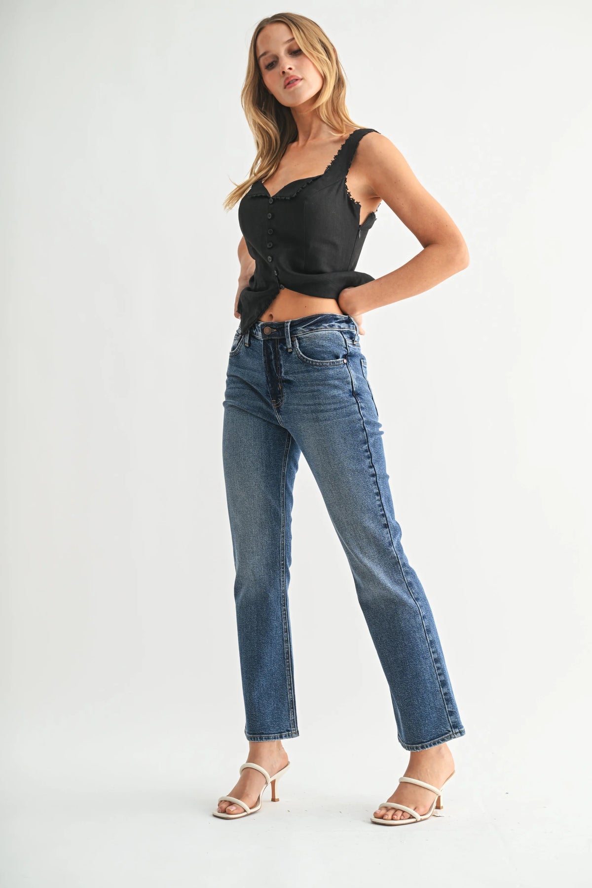 Women’s medium wash high rise slim cropped bootcut denim jeans for a modern look