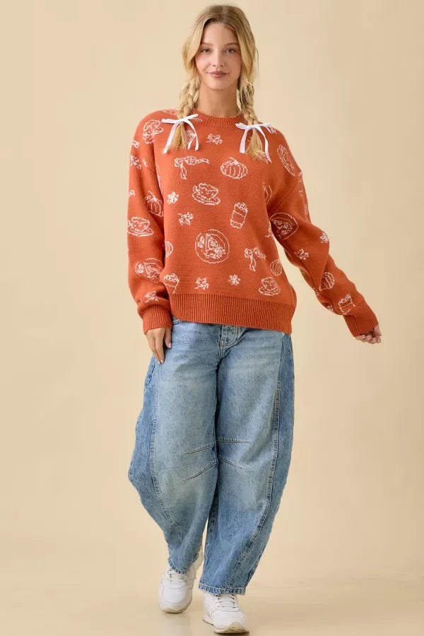 Women’s oversized orange pumpkin spice printed sweater with white pumpkin and coffee graphics