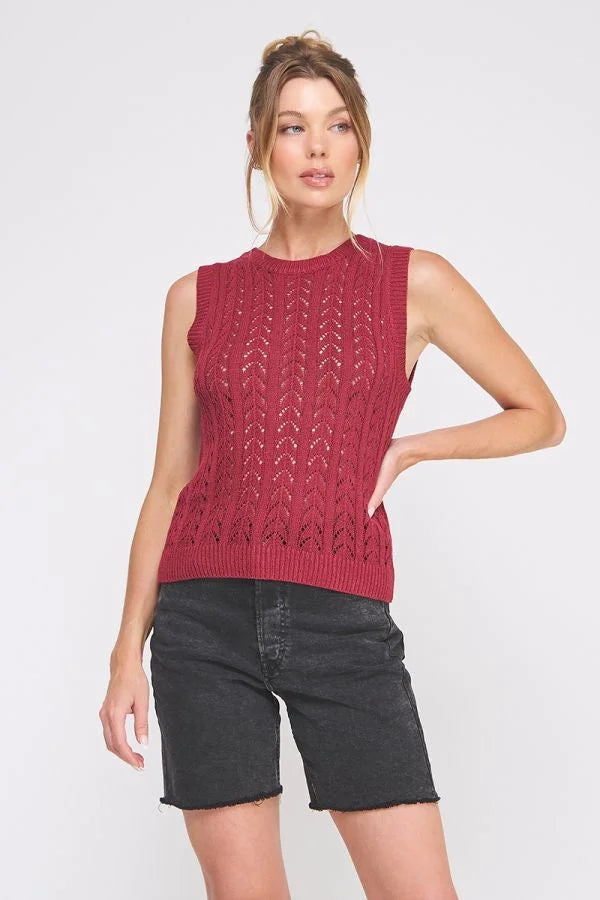Women’s sleeveless crochet sweater vest with openwork pattern and crew neck design