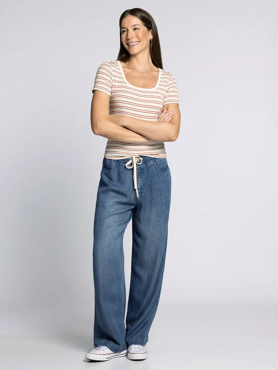 Women’s striped short-sleeve top with wide-leg denim pants featuring the Supply Katara Tee style