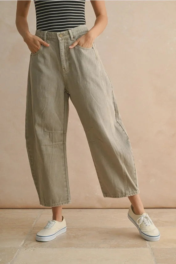 Women’s striped tank top with baggy cropped khaki barrel cotton pants and white sneakers