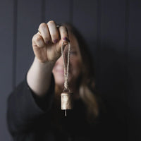 Barrel brass bell ornament with wooden twine handle