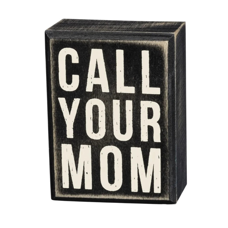 Wooden box sign featuring the words Call Your Mom for home decor inspiration