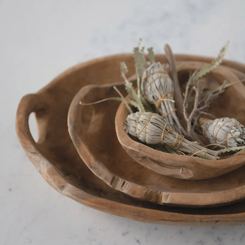 Teak Wood Bowls with Handles holding bundled sage smudge sticks for cleansing rituals