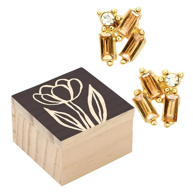 Wooden treasure box with floral design and gold earrings showcasing Treasure Box Earrings - Golden Shadow
