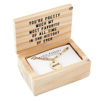 Wooden box featuring a GOLD CHAIN BESTIE NECKLACE and card for women’s boho chic clothing