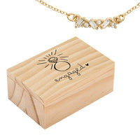 Wooden engagement ring box with a gold necklace from the Treasure Box Necklace collection