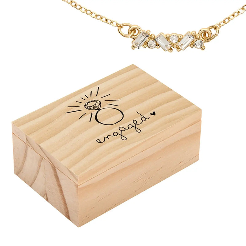 Wooden engagement ring box with a gold necklace from the Treasure Box Necklace collection