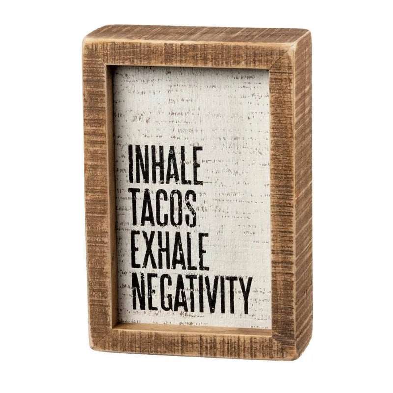 Wooden frame with black and white text featuring Inhale Tacos Exhale Negativity design