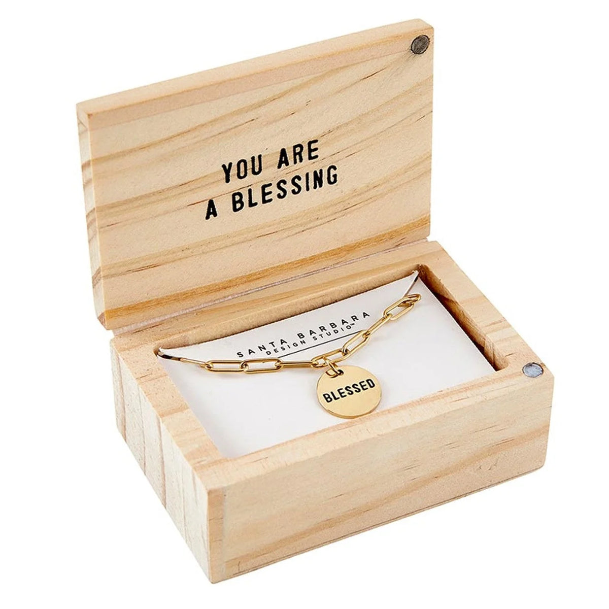 Wooden jewelry box featuring a gold bracelet with a blessed charm for shop daisy items