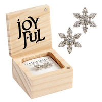 Wooden jewelry box featuring JOYFUL text with sparkly snowflake shaped earrings displayed