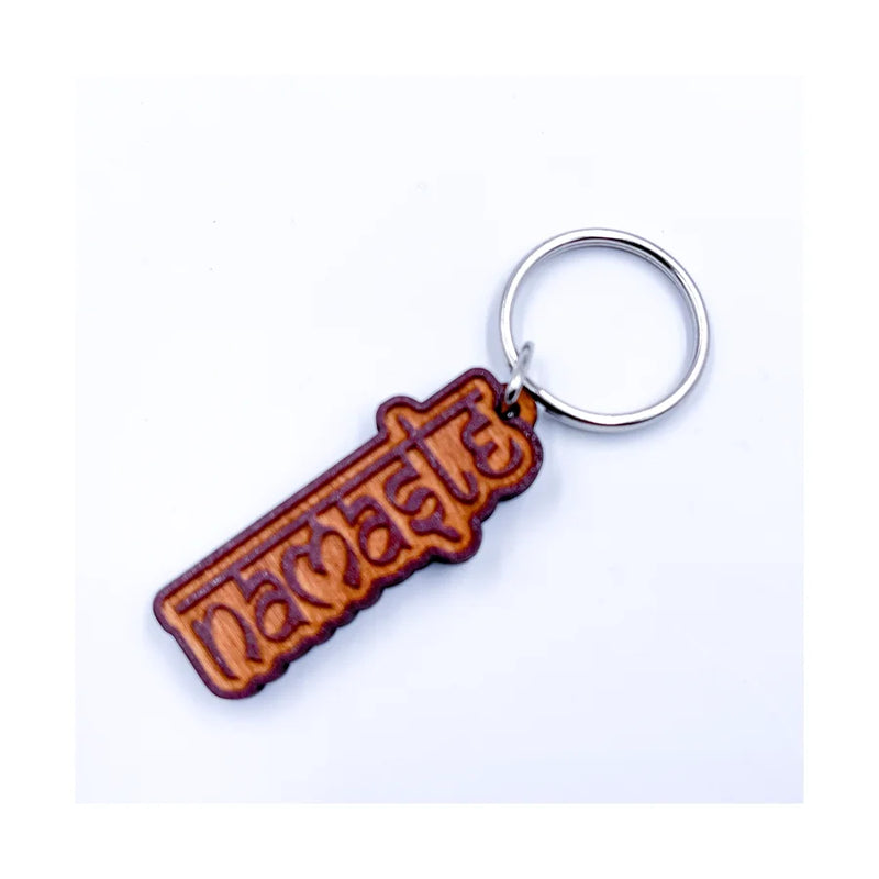 Alt text for a Namaste Wooden Key Chain featuring the word in Sanskrit, showcasing craftsmanship