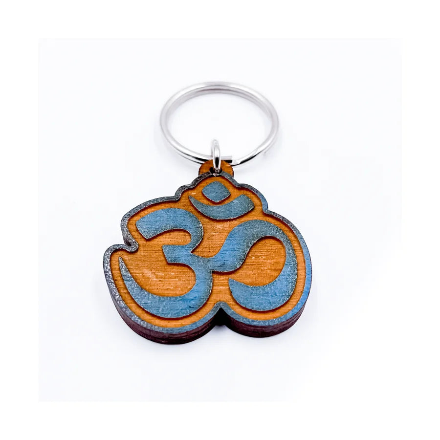 Wooden key chain featuring an Om symbol, perfect for spiritual enthusiasts