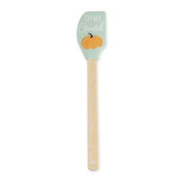 Wooden spatula with a mint green silicone head and pumpkin design for autumn baking silicone