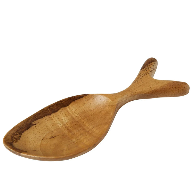 A wooden spoon with a handle next to an Acacia Wood Fish Shaped Dish