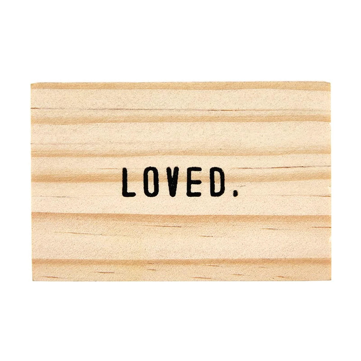 LOVED in black text on wooden planks, featured in the Gold Chain Loved Necklace from Shop Daisy