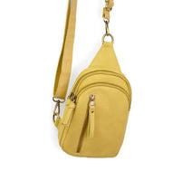 Yellow Skyler Sling Bag in vegan leather with convertible strap and zippered pockets