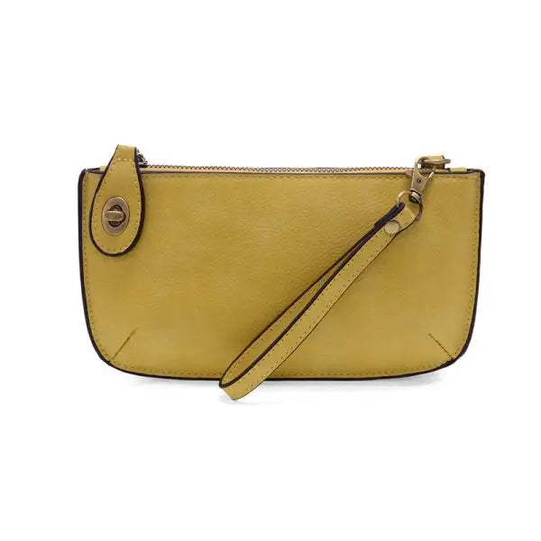 Yellow leather wristlet clutch featuring card slots from the MINI CROSSBODY WRISTLET CLUTCH