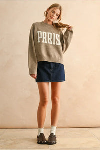 Young woman wearing PARIS LETTER FRONT sweater with boho chic style, shop Daisy