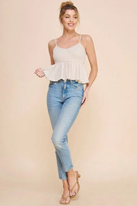 Young woman in white sleeveless top and jeans showcasing LINEN BLEND SMOCK CAMI TANK BABYDOLL