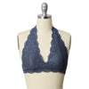 A mannequin wearing a gray halter top lace bralette.